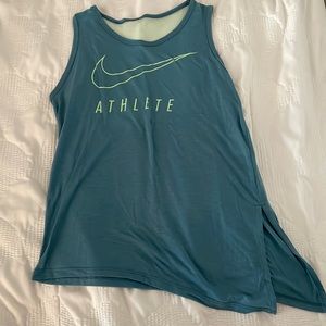 green nike athletic tank top with mesh on the back & a slight slit on the side